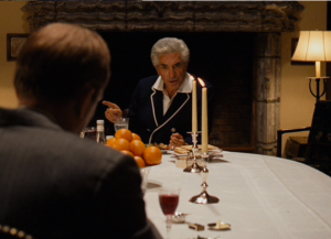 Jack Woltz (John Marley) sits in front a large bowl of oranges in "The Godfather" (1972)